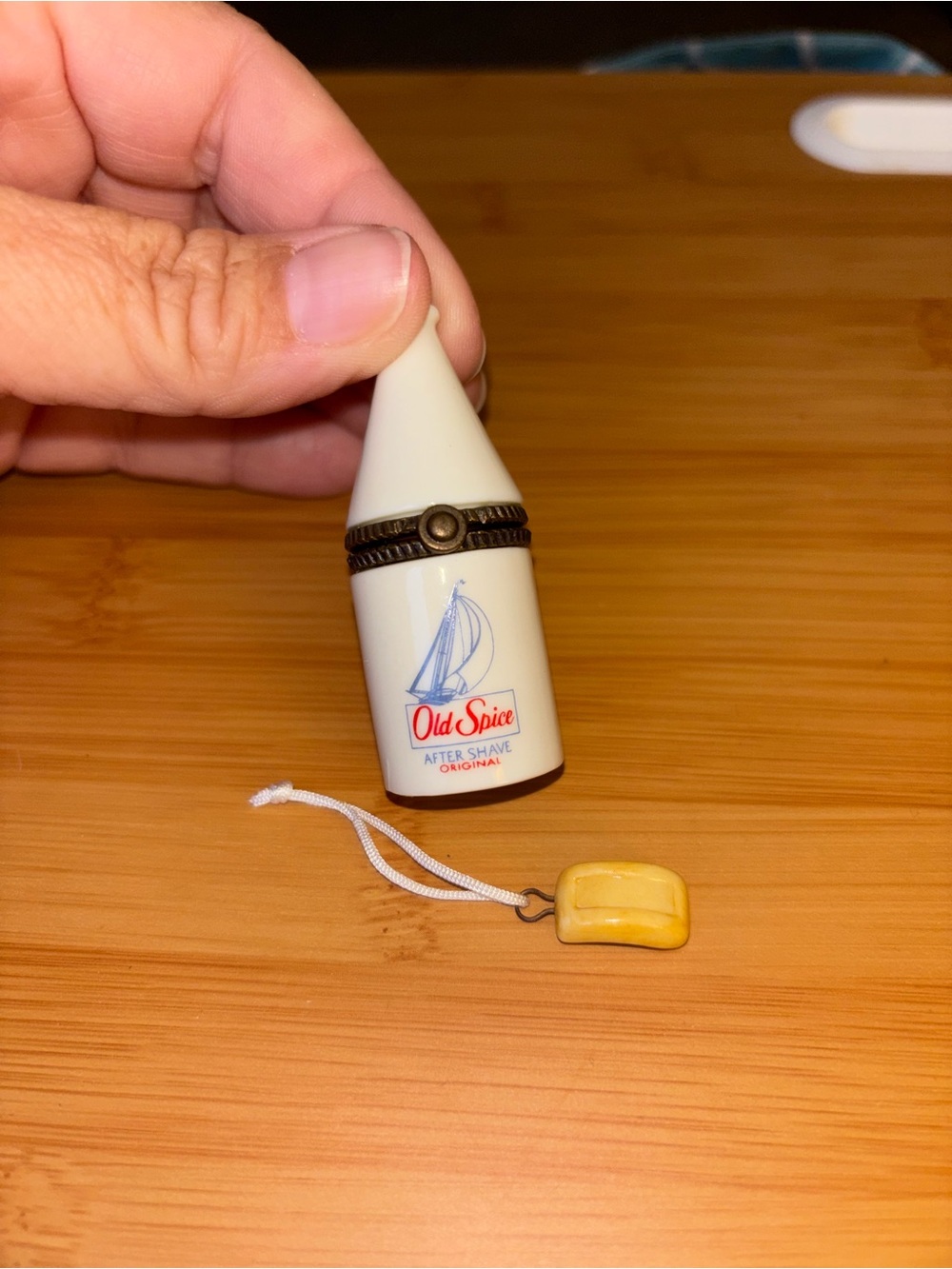 Cream Ceramic Trinket Old Spice Bottle with Sailboat Logo and soap on a rope